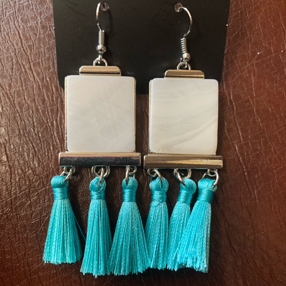 White marble with blue tassels